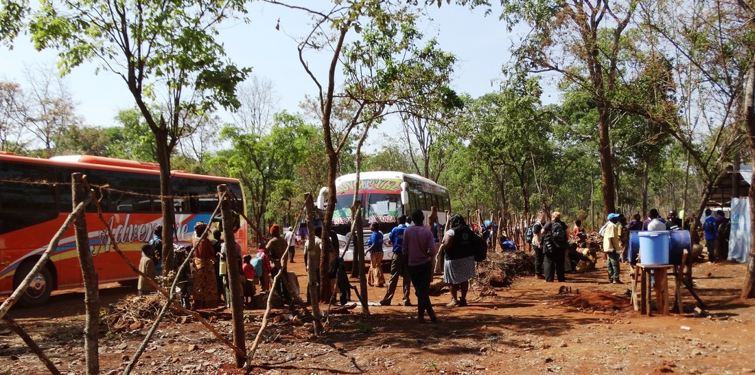 Burundian refugees arrive by bus at Nduta camp, Tanzania