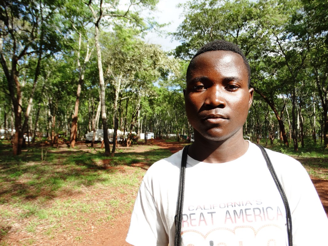 A teenage boy stands in Nduta refugee camp, Tanzania.