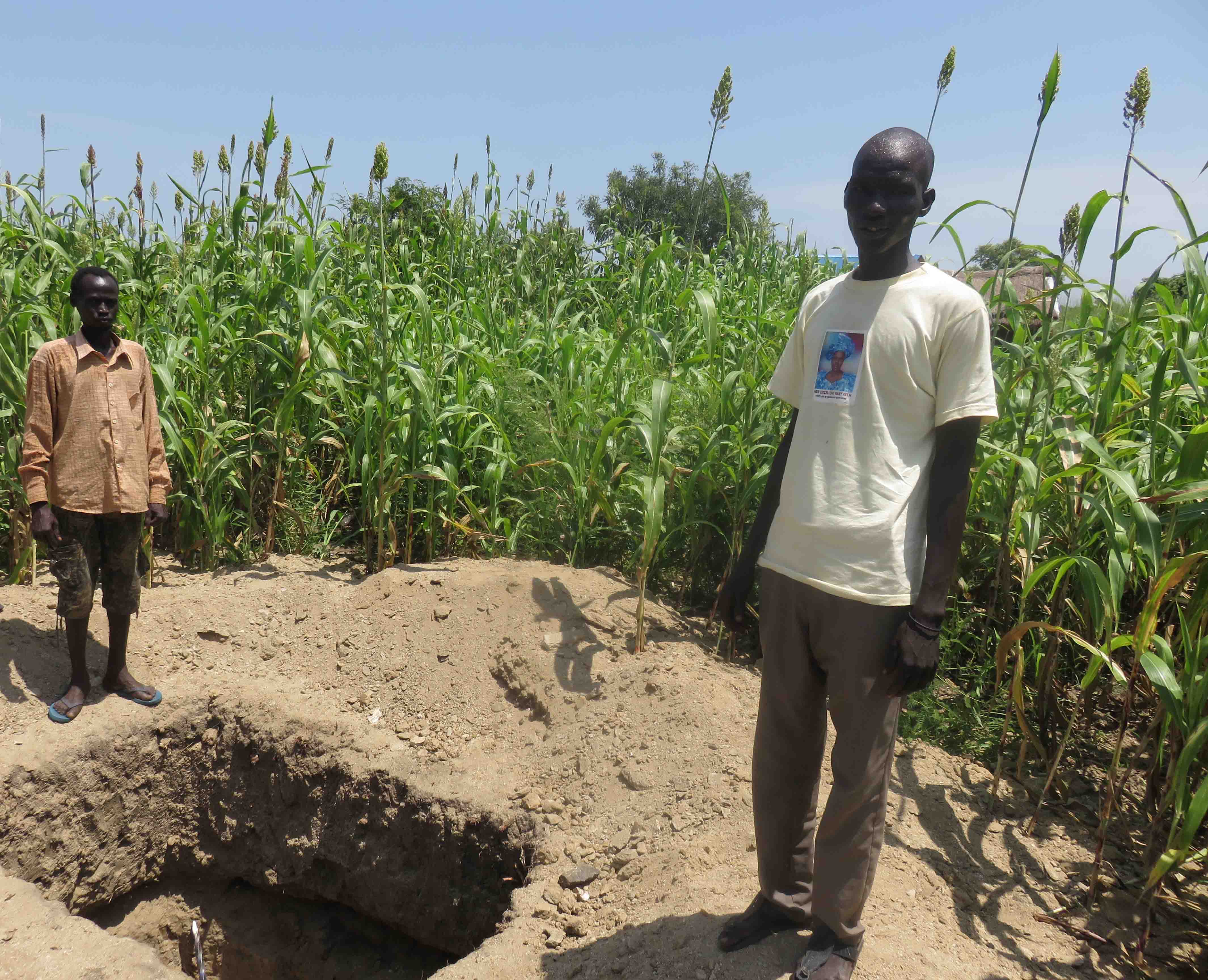 A young man builds latrines with Oxfam's help in Juba, South Sudan