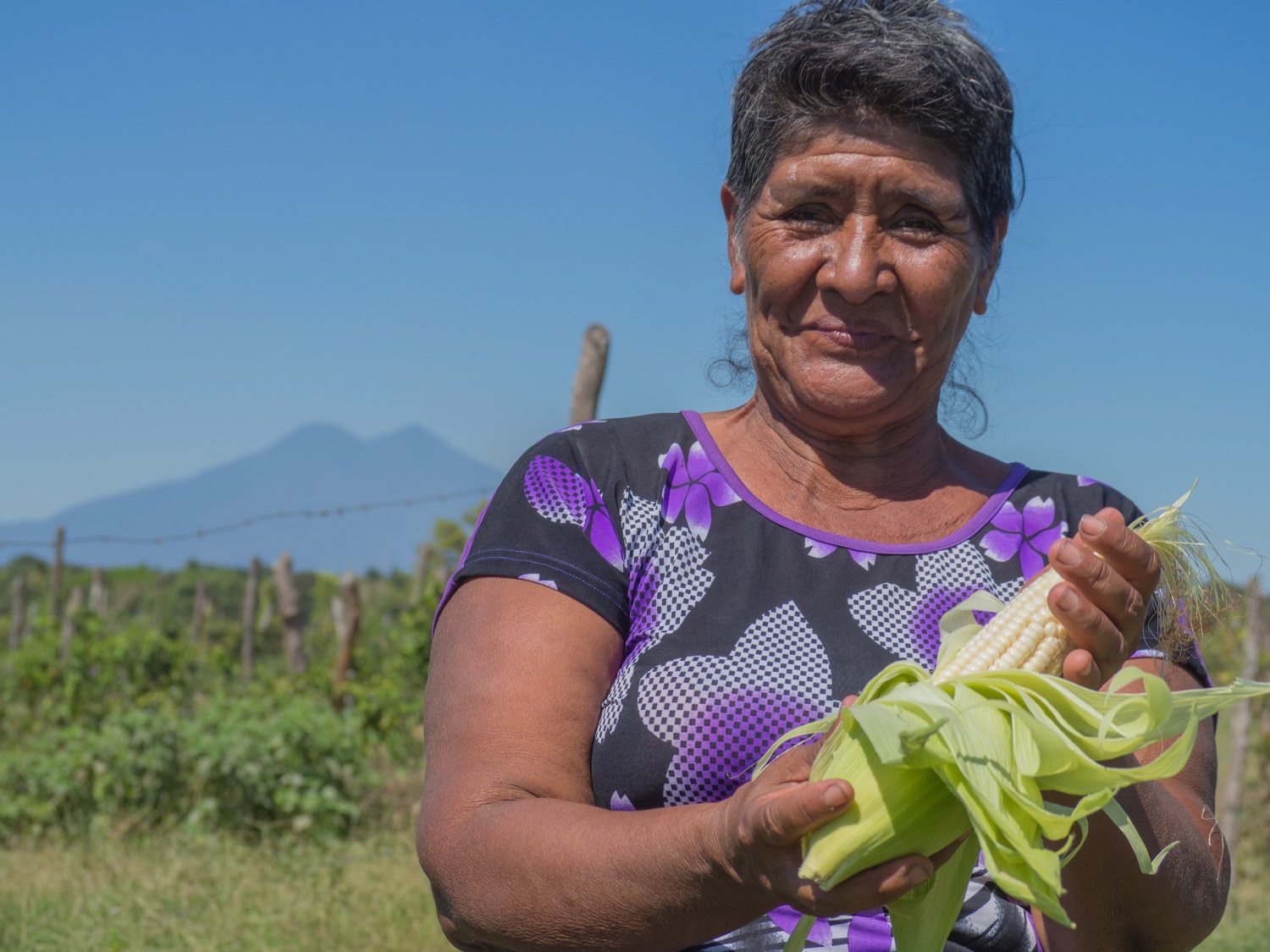 Farmer Flor Aquino displays corn grown on a community plot in El Ranchón, as part of a program focused on building resilience to drought. While the country is reeling from the effects of El Niño