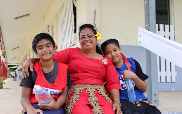 Nuka Talanoa is the principal of the Pangai Primary School in rural Ha'apai island, Tonga. Her students, Christopher and Nanise, are members of the WASH club, teaching younger students proper handwashing and water conservation techniques. Her school supplies water not just to the student body, but also to the neighbouring community.