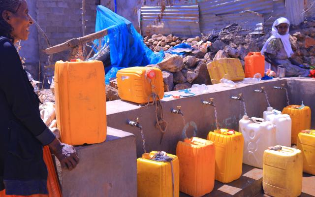 Water flows from multiple taps at Meshano spring water point in Birhan kebelle (Tsimbla woreda, Tigray), helping families collect water more quickly.