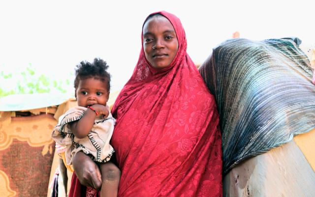 Fatimoutou Wallet holding her child in Gao region of Mali.