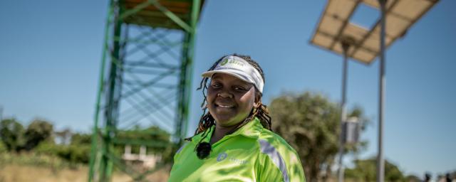 Takudzwa, 33yrs, an Oxfam WASH Engineer is photographed at a Oxfam funded solar piped water system in Somertone village, Masvingo District, Zimbabwe. The system will supply water to a local school and clinic as well as many families in the local community. Takudzwa, 33yrs, an Oxfam WASH Engineer is photographed at a Oxfam funded solar piped water system in Somertone village, Masvingo District, Zimbabwe. The system will supply water to a local school and clinic as well as many families in the local community.