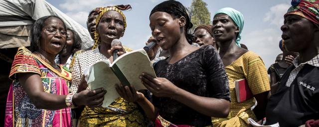 Displaced Congolese join in on a Easter church ceremony inside an Internally Displaced Persons (IDP) camp in Bunia, April 01, 2018.