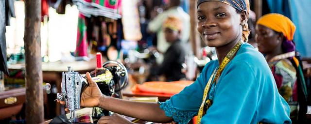 Oxfam livelihoods project tailoring studio in the Nyarugusu refugee camp in Tanzania. Oxfam gave out grants to groups of refugees to start businesses that would provide them with an income, and several people now work here as tailors. Credit: Amy Christian/Oxfam Oxfam livelihoods project tailoring studio in the Nyarugusu refugee camp in Tanzania. Oxfam gave out grants to groups of refugees to start businesses that would provide them with an income, and several people now work here as tailors. Credit: Amy Christian/Oxfam