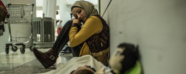 Fatem, refugee from Syria, was selected to go to Italy with her family through a humanitarian visas programme. Photo: Pablo Tosco/Oxfam