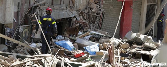 French fireman and a rescue dog search in the rubble of a building after the Tuesday explosion at the seaport of Beirut, in Beirut, Lebanon.