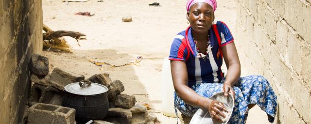 Zoré Fatimata in front of her house, Burkina Faso
