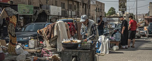 A man sells beans in Ein al Basha vegetable market, Amman, Jordan.