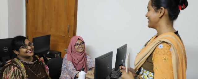 Maksuda Parvin, entrepreneur, at Women in Digital training session with Touhida Akter Songita, a digital marketer, and Jahanara Akter, web developer. All three women have received training at Women in Digital - which has given them confidence and vital tech and storytelling knowledge.