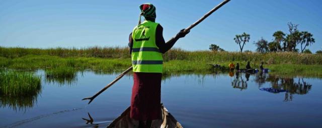 “When the crisis happened, I was fortunate to have the canoe because we were able to leave Nyal and move safely to the islands. Many people were not so fortunate, so I helped where I could.” Martha Nyabany, canoe operator. Photo: Stella Madete/Oxfam