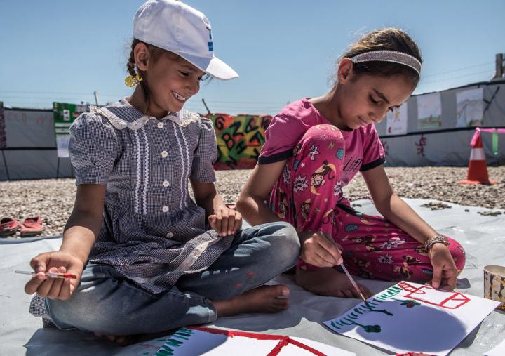 Children take part in a fun painting workshop organised by Oxfam's PHP team in Hassansham camp, Iraq. Tommy Trenchard / Oxfam Children take part in a fun painting workshop organised by Oxfam's PHP team in Hassansham camp, Iraq. Tommy Trenchard / Oxfam