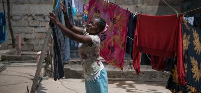 Tabitha Mwikali, 36, a domestic worker hanging clothes for her employer in Eastleigh, Nairobi, Kenya. Credit: Allan Gichigi/Oxfam
