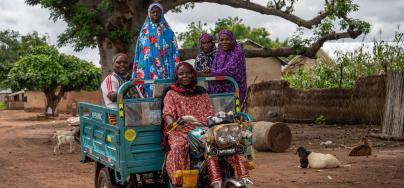 Members of the Tungteiya Women’s Association Shea Butter Processing Center, Diaré rely on the new tricycle they received from Oxfam to help them access markets and move their produce around more easily.