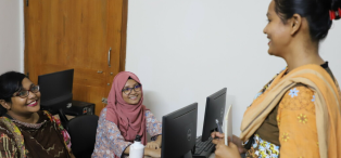 Maksuda Parvin, entrepreneur, at Women in Digital training session with Touhida Akter Songita, a digital marketer, and Jahanara Akter, web developer. All three women have received training at Women in Digital - which has given them confidence and vital tech and storytelling knowledge.