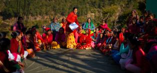 Pramila Bhul speaking to members of a Women’s Cooperative during its annual meeting.