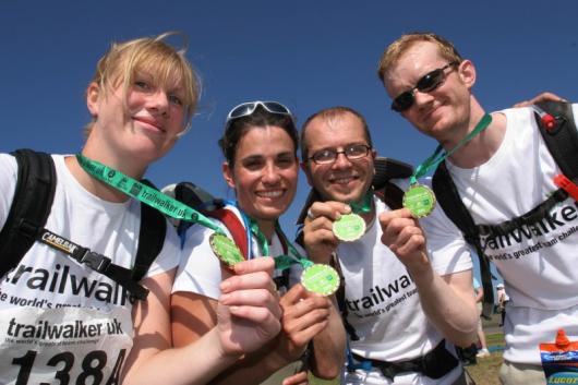 Trailwalker team show completion medals