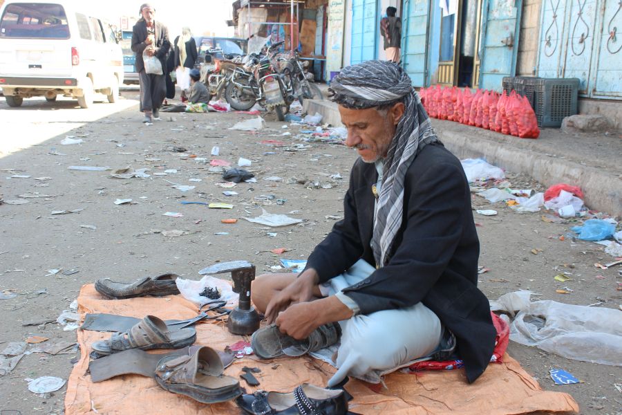 Ahmed works as a cobbler in the market. On good days, he manages to make 500 Yemeni Riyals ($2) a day.